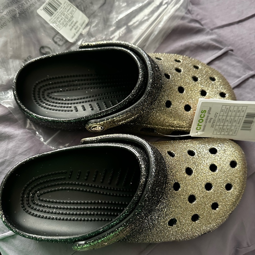 CROCS Black and Gold Slippers with Perforated Design